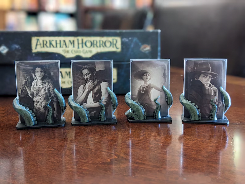 Top Shelf Gamer | The Best Arkham Horror: The Card Game Upgrades and Accessories | Investigator Card Stands compatible with Arkham Horror LCG (set of 4) Top Shelf Gamer | The Best Arkham Horror: The Card Game Upgrades and Accessories | Investigator Card Stands compatible with Arkham Horror LCG (set of 4)